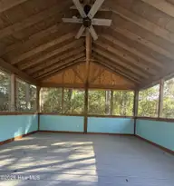 108 NW 29th Street, Oak Island, NC 28465 — 3-bedroom home in Pinners Point, Oak Island, NC, photo 13 of 16: Screened Room