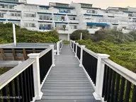 351 Salter Path Road 402, Pine Knoll Shores, NC 28512 — 3-bedroom waterfront condo in Bogue Shore Club, Pine Knoll Shores, NC, photo 14 of 15: Walkway, Situm and Shower area