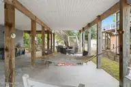 133 NE 3rd Street, Oak Island, NC 28465 — 3-bedroom home, Oak Island, NC, photo 22 of 27: Under pilings