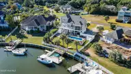 120 Inlet Point Drive, Wilmington, NC 28409 — 4-bedroom waterfront home in Inlet Point Harbor, Wilmington, NC, photo 2 of 37: 120InletPointDriveDrone-5