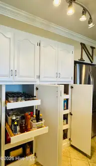 1008 Bateman Drive, Elizabeth City, NC 27909 — 4-bedroom waterfront home in Bateman Estates, Elizabeth City, NC, photo 20 of 74: Pantry 2 w/ pull out drawers!