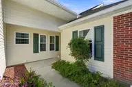 507 Sunset Oaks Lane, Sunset Beach, NC 28468 — 3-bedroom townhome in Sunset Oaks Garden Homes, Sunset Beach, NC, photo 19 of 22: 7_front patio exterior
