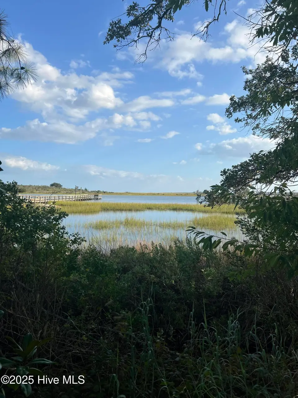 1139 Indigo Circle, Sunset Beach, NC 28468 — waterfront lot in Seaside Station, Sunset Beach, NC, photo 1 of 7