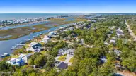 111 SW 22nd Street, Oak Island, NC 28465 — 4-bedroom home in Pinners Point, Oak Island, NC, photo 4 of 73: aerial canal and ocean