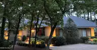 65 Stoneykirk Drive, Pinehurst, NC 28374 — 3-bedroom home in Pinewild CC, Pinehurst, NC, photo 1 of 45: Dusk Photo