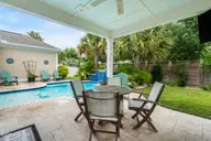 1620 Harbour Place Drive, Calabash, NC 28467 — 3-bedroom home in Kingfish Bay, Calabash, NC, photo 14 of 75: Backyard Lanai
