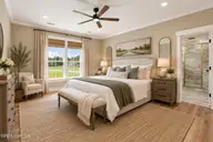 7451 Grover Road, Nashville, NC 27856 — 4-bedroom home in Whispering Pines, Nashville, NC, photo 20 of 65: Staged Primary Bedroom