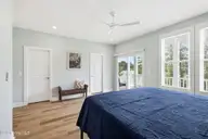 111 Jade Street, Beaufort, NC 28516 — 3-bedroom home in Jade Point, Beaufort, NC, photo 15 of 49: Primary bedroom with porch access