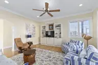 516 Blue Heron Drive, Newport, NC 28570 — 3-bedroom waterfront home in Blue Heron Bay, Newport, NC, photo 14 of 62: Living room with screened porch access