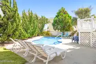14 Private Drive, Ocean Isle Beach, NC 28469 — 5-bedroom home in Summer Place, Ocean Isle Beach, NC, photo 17 of 64: Pool Lounges