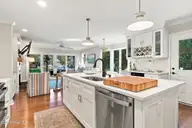 152 Arborvitae Drive, Pine Knoll Shores, NC 28512 — 3-bedroom waterfront home in Pine Knoll Association, Pine Knoll Shores, NC, photo 16 of 61: Kitchen and Great Room