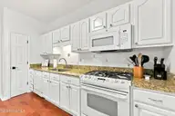 109 Oakleaf Drive, Pine Knoll Shores, NC 28512 — 3-bedroom waterfront home in Fairway Villas, Pine Knoll Shores, NC, photo 22 of 66: Kitchen