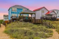 2201 E Beach Drive, Oak Island, NC 28465 — 5-bedroom waterfront home in East Beach, Oak Island, NC, photo 1 of 38