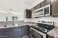 131 Beacon Woods Drive, Holly Ridge, NC 28445 — 2-bedroom townhome in The Townes At Holly Ridge, Holly Ridge, NC, photo 5 of 38: Kitchen