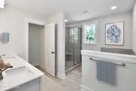 1034 Paddington Avenue NE, Leland, NC 28451 — 5-bedroom home in Parkwood Estates, Leland, NC, photo 17 of 23: 16 primary bath