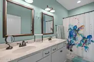 129 NW 11th Street, Oak Island, NC 28465 — 3-bedroom home in Pinners Point, Oak Island, NC, photo 19 of 63: master bath