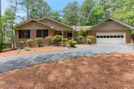 25 Firestone Lane, Pinehurst, NC 28374 — 3-bedroom home in Unit 1, Pinehurst, NC, photo 1 of 23: 25 Firestone Lane