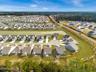 333 Eagle Claw Drive 4037, Carolina Shores, NC 28467 — 3-bedroom home in Eagle Run, Carolina Shores, NC, photo 3 of 23: Lot from drone view