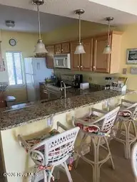 801 Salter Path Road 108, Indian Beach, NC 28512 — 1-bedroom waterfront condo in Windward Dunes, Indian Beach, NC, photo 6 of 12: Kitchen/bar stool