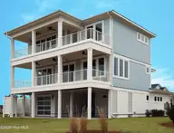 123 Seafaring Lane, Hampstead, NC 28443 — 4-bedroom waterfront home in Salters Haven at Lea Marina, Hampstead, NC, photo 3 of 52: Rear Elevation