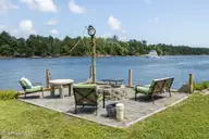 1074 Sea Gate Drive, Newport, NC 28570 — 3-bedroom waterfront home in Sea Gate, Newport, NC, photo 11 of 59: Firepit