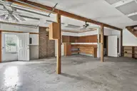 2645 Scotts Hill Loop Road, Wilmington, NC 28411 — 3-bedroom home in Scotts Hill, Wilmington, NC, photo 21 of 28: Garage with bathroom