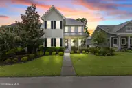 409 Cornubia Drive, Castle Hayne, NC 28429 — 3-bedroom waterfront home in River Bluffs, Castle Hayne, NC, photo 1 of 76