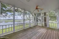 112 Coastal Bluffs Court, Hampstead, NC 28443 — 4-bedroom waterfront home in Olde Point, Hampstead, NC, photo 22 of 37: Screened Porch
