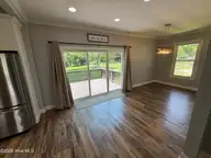 702 N Charlotte Street, Washington, NC 27889 — 3-bedroom home, Washington, NC, photo 13 of 36: sliding rear door and large dining area