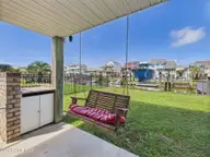 117 Salisbury Street, Holden Beach, NC 28462 — 3-bedroom waterfront home, Holden Beach, NC, photo 24 of 40: \Covered Outdoor Seating