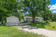 1660 White Duck Court SW, Supply, NC 28462 — 3-bedroom manufactured home in Wood Duck Retreat, Supply, NC, photo 1 of 28: Front view from street