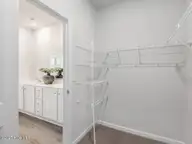4246 Allsbrook Lane Unit 1011, Leland, NC 28451 — 3-bedroom townhome in Indigo Preserve, Leland, NC, photo 20 of 42: Walk in Primary Closet