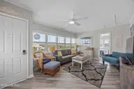 5127 W Beach Drive, Oak Island, NC 28465 — 5-bedroom waterfront home, Oak Island, NC, photo 10 of 73: 39_sun room