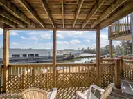8713 Plantation Drive 402, Emerald Isle, NC 28594 — 3-bedroom waterfront townhome in Emerald Plantation, Emerald Isle, NC, photo 22 of 68: Lower Deck 2