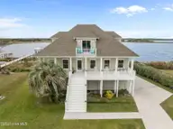 3 Osprey Circle, North Topsail Beach, NC 28460 — 3-bedroom waterfront home in Crystal Shores, North Topsail Beach, NC, photo 2 of 70: Front of the House