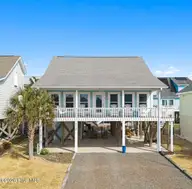 112 Sunshine Lane, Holden Beach, NC 28462 — 3-bedroom home in Colonial Beach, Holden Beach, NC, photo 2 of 72: 1-web-or-mls-cammediallc.com edit 1