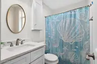501 Shoreline Drive E, Sunset Beach, NC 28468 — 3-bedroom waterfront home in Shoreline Woods, Sunset Beach, NC, photo 21 of 39: Second full bathroom on main floor