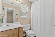 316 NE 52nd Street, Oak Island, NC 28465 — 3-bedroom home in Tranquil Harbor, Oak Island, NC, photo 23 of 49: 24_bathroom
