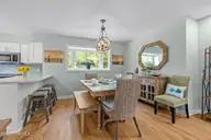 300 Mcginnis Drive, Pine Knoll Shores, NC 28512 — 3-bedroom waterfront condo in Mcginnis Point, Pine Knoll Shores, NC, photo 16 of 57: Dining 2