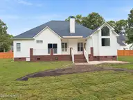 105 Scallop Place, Goldsboro, NC 27530 — 3-bedroom home in The Reach, Goldsboro, NC, photo 21 of 26: Rear porch bathed in soft daylight