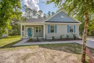 1858 E Boiling Spring Road, Southport, NC 28461 — 3-bedroom home in Boiling Spring Lakes, Southport, NC, photo 1 of 19: Front view of property