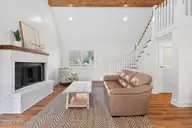 501 Shoreline Drive E, Sunset Beach, NC 28468 — 3-bedroom waterfront home in Shoreline Woods, Sunset Beach, NC, photo 11 of 39: Bright tall ceilings and beams
