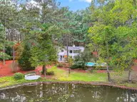 255 Lake Dornoch Drive, Pinehurst, NC 28374 — 4-bedroom waterfront home in CCNC, Pinehurst, NC, photo 6 of 69: Drone Rear