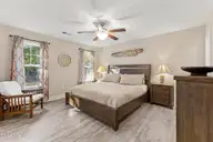 117 NE 19th Street, Oak Island, NC 28465 — 3-bedroom home in Tranquil Harbor, Oak Island, NC, photo 19 of 77: Primary Bedroom