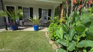 108 Willowbend Drive, Burgaw, NC 28425 — 3-bedroom home in Tealbriar, Burgaw, NC, photo 6 of 27: Lush Floral Garden