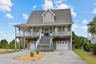 108 Kiawa Drive, Indian Beach, NC 28512 — 4-bedroom waterfront home in Kiawa, Indian Beach, NC, photo 1 of 54: hilltop Home