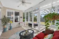 1230 Nightingale Court, Leland, NC 28451 — 3-bedroom waterfront home in Waterford of the Carolinas, Leland, NC, photo 7 of 75: Sunroom