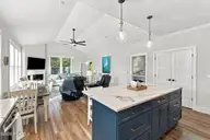 210 River Oats Court, Holly Ridge, NC 28445 — 4-bedroom waterfront home in Redd's Cove, Holly Ridge, NC, photo 14 of 69: 38_kitchen, dining, living area