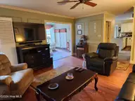 528 Ole Farm Trail, Whiteville, NC 28472 — 4-bedroom home in Runnymeade, Whiteville, NC, photo 7 of 32: Living Room 2