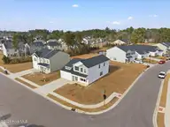 4499 Parsons Mill Drive, Castle Hayne, NC 28429 — 4-bedroom home in Parsons Mill, Castle Hayne, NC, photo 1 of 49: 02-DJI_20260108140850_0101_D-Edit